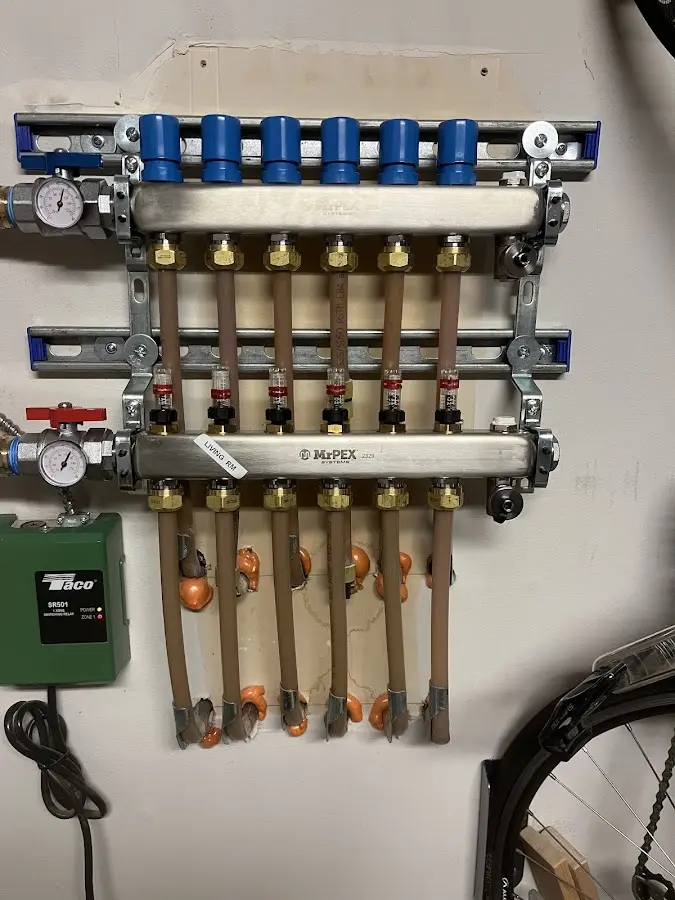 Plumber performing Water Heater Repair at a residential property in Groveland